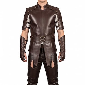 May include: A brown leather outfit featuring a short-sleeved jacket with shoulder accents, a double-buckle belt, and matching pants with cut-out details. The outfit includes fingerless gloves and arm cuffs. The jacket has a high collar.