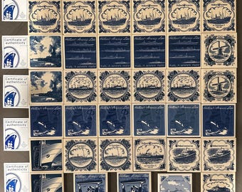 May include: A collection of 36 vintage blue and white ceramic tiles featuring Holland America Line ships and scenes. The tiles are in a grid pattern and feature various designs, including ships, sailboats, windmills, and the text "Holland America Line".