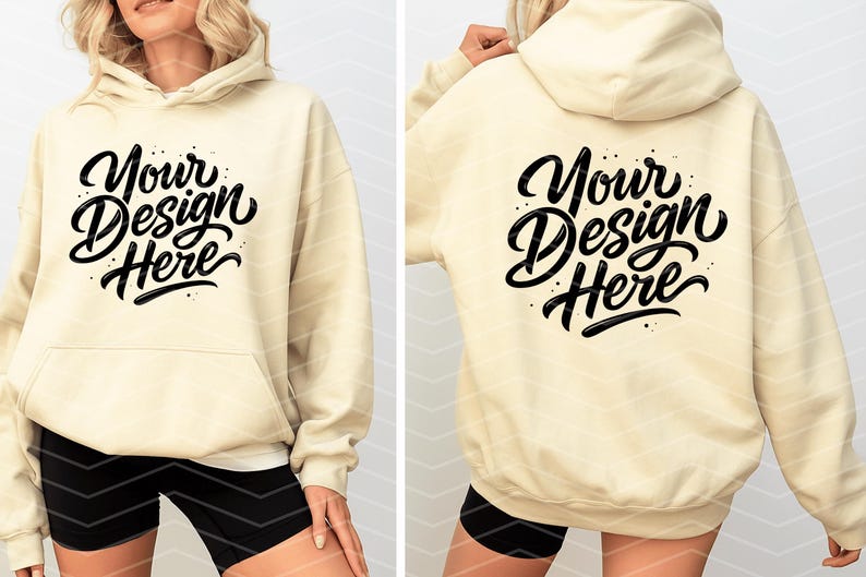 May include: Cream-colored hoodie with a front pocket and drawstring hood. The front and back of the hoodie feature the text "Your Design Here" in a black, stylized script. The model is wearing black shorts.