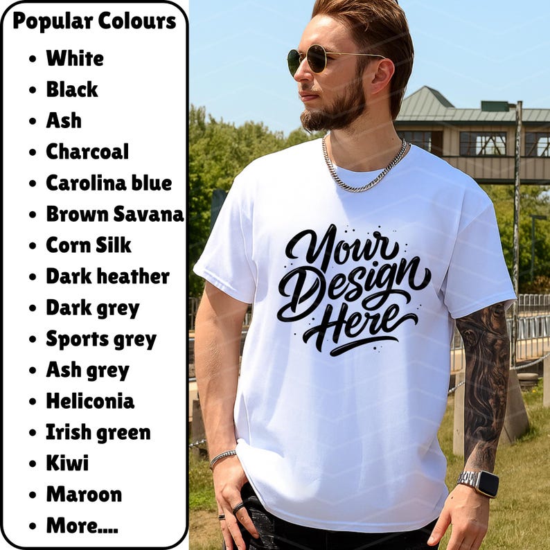 May include: A white t-shirt with the text "Your Design Here" in a black, cursive font. The shirt is being worn by a person. A list of popular colors is on the left side of the image.