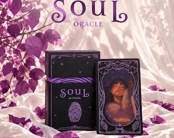 May include: A black oracle card deck box and a single card titled Soul. The box features the text Soul an Oracle and a fingerprint graphic. The card displays an illustration of a person with closed eyes surrounded by stars and cosmic light.