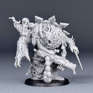 May include: A detailed grey plastic miniature of a grotesque, multi-eyed creature with a weapon in its hand. The creature is covered in chains and other intricate details.