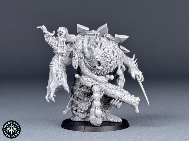 May include: A detailed grey plastic miniature of a grotesque, multi-eyed creature with a weapon in its hand. The creature is covered in chains and other intricate details.
