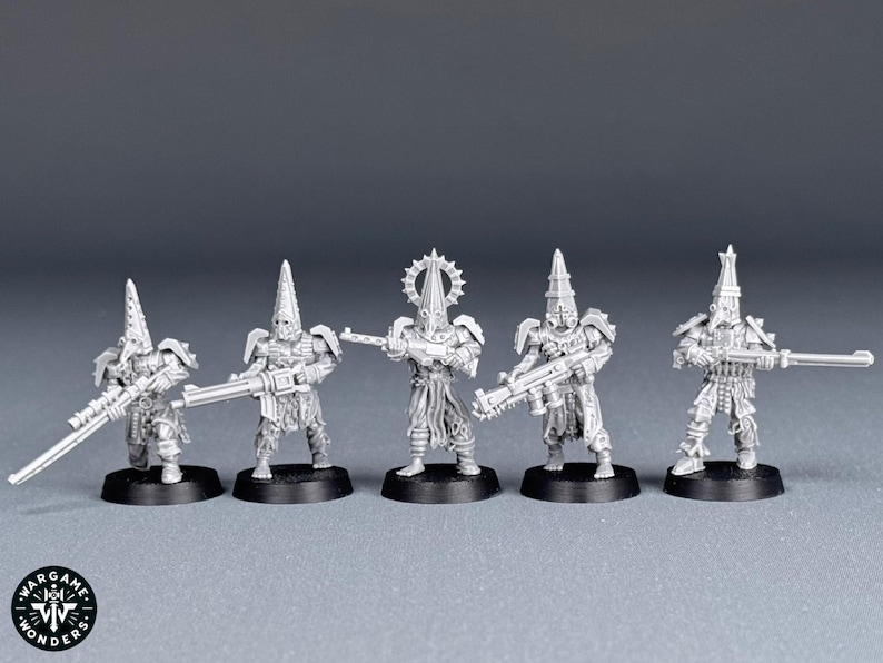 May include: Five unpainted plastic miniatures of figures wearing hooded robes and holding rifles. The figures are standing on circular bases.