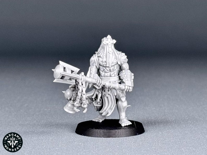 May include: A gray plastic miniature figure of a warrior holding a spiked mace with a chain. The figure is wearing a hooded cloak and armor. The figure is standing on a black base.