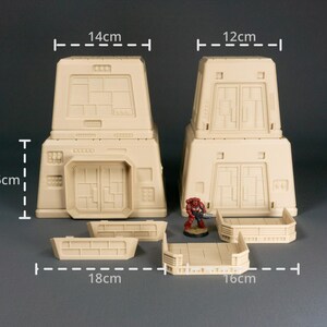 May include: A set of beige plastic modular building pieces for tabletop gaming. The set includes two towers, two walls, a walkway, and a small figure. The towers are 14 inches tall and 12 inches wide. The walls are 18 inches long and 10.5 inches tall. The walkway is 16 inches long.