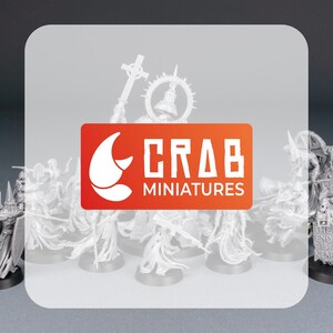 May include: A collection of unpainted miniature figures, likely for tabletop gaming. The figures are predominantly white and feature intricate details. The Crab Miniatures logo is prominently displayed in orange and white. The figures are on black bases.