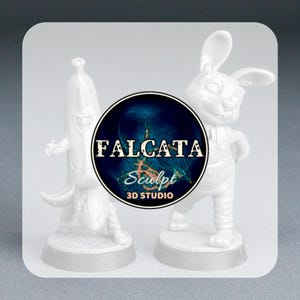 May include: Two white 3D-printed figurines: a banana with a face and a rabbit wearing overalls. The figurines are on a gray surface. A circular logo with the text "FALCATA Sculpt 3D STUDIO" is between them.