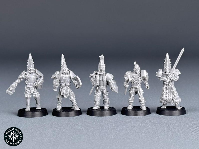 May include: Five grey plastic miniature figures of warriors wearing helmets and armor, standing on black circular bases.