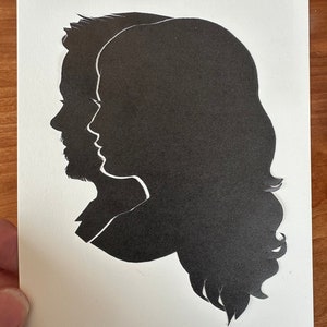 Hand Cut Double Silhouette Portrait by Master Silhouette Artist Karl Johnson- Not computer generated