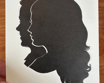 Hand Cut Double Silhouette Portrait by Master Silhouette Artist Karl Johnson- Not computer generated