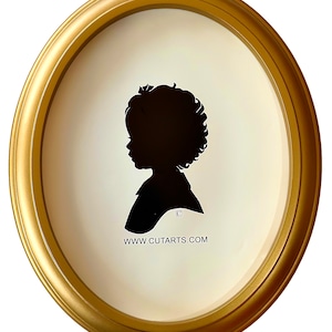 May include: A black silhouette of a child with curly hair in a gold oval frame. The silhouette is cut out of paper and the frame is made of wood. The website www.cutarts.com is printed at the bottom of the frame.