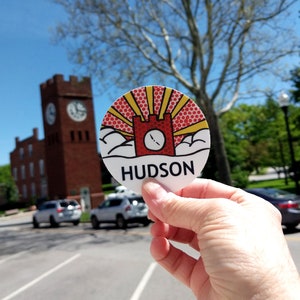 Hudson Ohio clock tower sticker 3 inches round, red and yellow pop art design.
