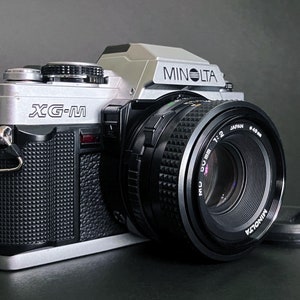 Minolta XG-M 35 mm-film-reflexcamera met Minolta MD 50 mm f:2-lens _ Uitstekend!
