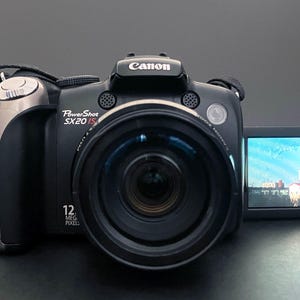 May include: A handmade wooden sign with the text "Welcome" in a playful font. The sign is painted white with a distressed finish, and features a decorative floral design in shades of pink and green. It is designed to be hung on a door or wall.