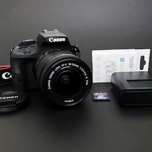 Canon EOS Rebel SL1 / 100D _ 18.0 Mp DSLR _ Touchscreen _ w/ Canon 18-55mm STM Zoom