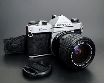 Pentax K1000 35 mm systemkamera med Sigma 35-70 mm f:2.8-4 makrozoom _ Mycket bra skick _ Nya tätningar