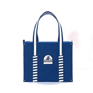 May include: A blue tote bag with white stripes and a white logo that says "SEQUOIA" with a stylized tree design.