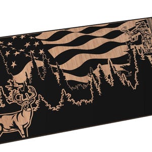 May include: A black and brown wooden sign with a deer silhouette and an American flag design. The deer is standing in a forest with trees and a waving flag in the background.