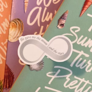 May include: White infinity symbol sticker with the text "He gave me the moon and the stars" on a teal background with white text.