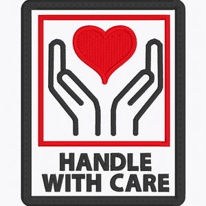 May include: Embroidered patch with a black border, a red square, and a white background. The design features a red heart held by two black hands, with the words "HANDLE WITH CARE" in black block letters.