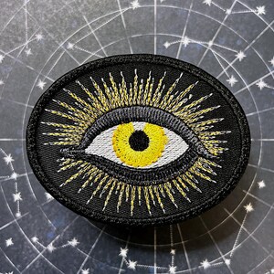 Handgemachtes strahlendes alles sehendes Auge Bügelbild GELB