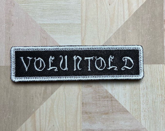 VOLUNTOLD Iron-On Patch, Old E