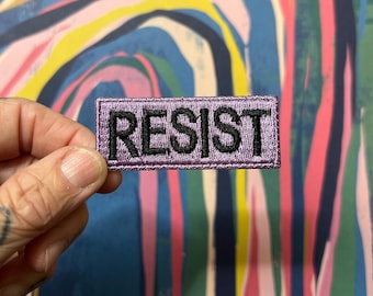 RESIST - Wee little violet patch with block lettering