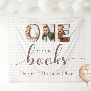 May include: A beige and white checkered backdrop banner with the words "ONE for the books" in brown script. The word "ONE" features three baby photos. The banner reads "Happy 1st Birthday Oliver" and includes a balloon with "4 DESIGN OPTIONS".