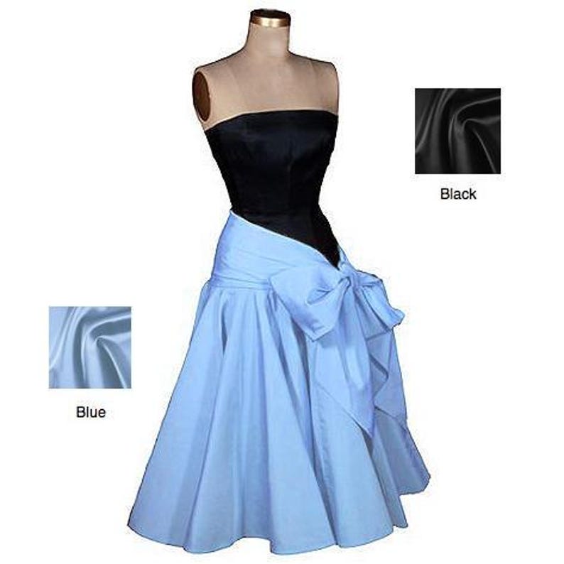 May include: A strapless dress with a black bodice and a light blue skirt. The skirt is tied with a large bow at the waist.