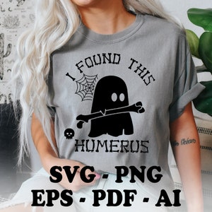 May include: A gray t-shirt with a black ghost holding a bone and the text "I found this humerus".