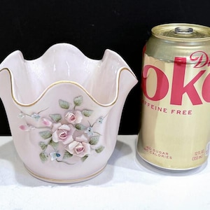 May include: A set of three ceramic mugs with a speckled, matte finish. The mugs are in shades of cream, light gray, and dark gray. Each mug has a simple, minimalist design, perfect for coffee or tea.