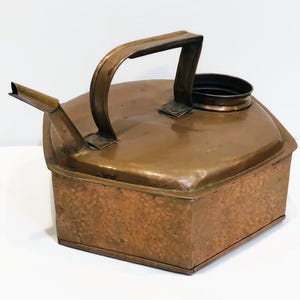 May include: A copper watering can with a hammered finish and a spout. The can has a handle and a round opening at the top.
