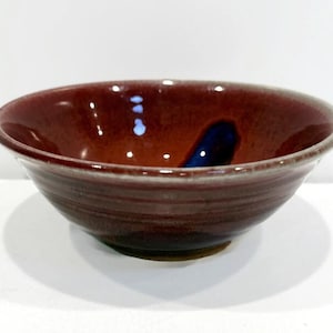 May include: A white ceramic mug with a black handle and the text "But First, Coffee" in a handwritten style. The mug is likely 11-15 ounces, suitable for hot beverages. Perfect for coffee or tea.