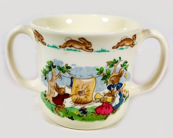 Vintage Royal Doulton "Bunnykins" Child's Two Handled Ceramic Mug, "Hug a Mug" Shape- "Rug Beating", Includes Original Box