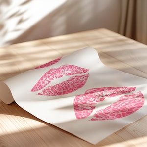 Framed wall art print featuring three pink lips with a leopard print design, arranged vertically on a white background, leaning against a pink paneled wall in a well-lit room.