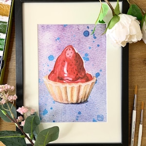 Framed watercolour print of a Scottish strawberry tart on a splattered purple and blue background, on a wooden table surrounded by paintbrushes and flowers