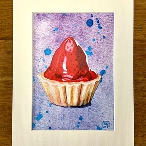 Watercolour print of a Scottish strawberry tart on a splattered purple and blue background, on a wooden table surrounded by paintbrushes and flowers