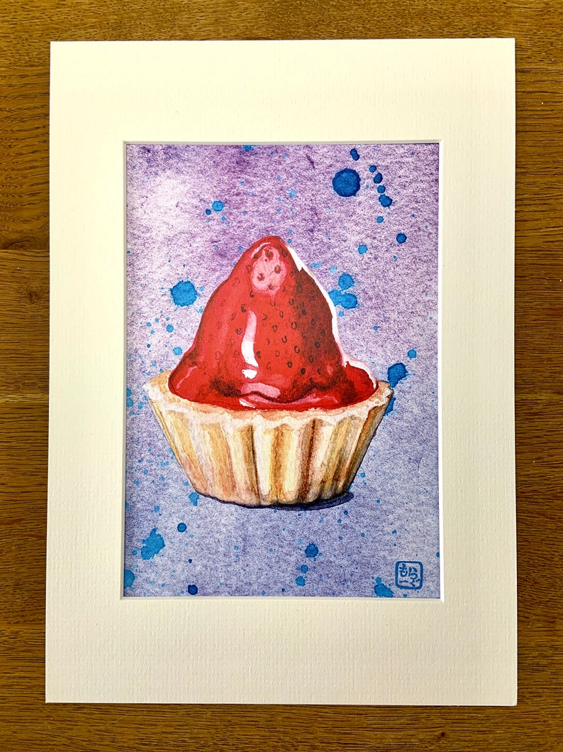 Watercolour print of a Scottish strawberry tart on a splattered purple and blue background, on a wooden table surrounded by paintbrushes and flowers