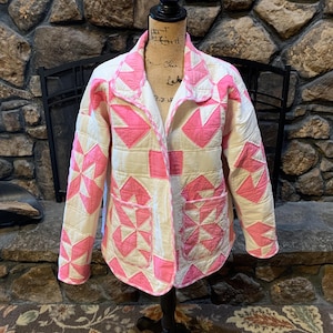 Pink and white quilted jacket with gingham trim.
