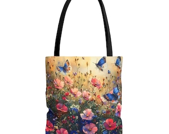May include: Tote bag featuring a vibrant floral and butterfly design. The bag showcases a field of pink, red, and blue flowers with several blue butterflies. It has a black handle and a light yellow background.