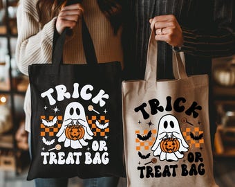 May include: Two Halloween tote bags, one black and one beige. Each bag displays the text "TRICK OR TREAT BAG" with a ghost holding a pumpkin, bats, and sweets. The design incorporates orange and white chequered patterns.