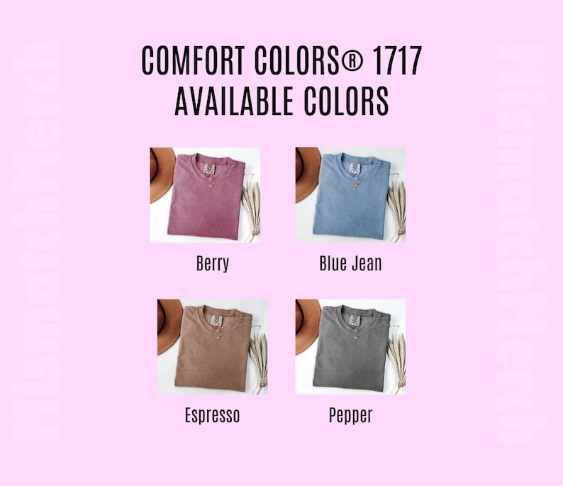 May include: A color chart for Comfort Colors 1717 t-shirts displaying four folded shirts in berry, blue jean, espresso, and pepper colors. Each shirt is shown next to a brown hat and dried foliage. The text reads Comfort Colors 1717 Available Colors.