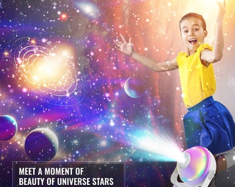 May include: A white projector with a rainbow-colored sphere projects a colorful image of a galaxy with stars and planets onto a wall. The text "MEET A MOMENT OF BEAUTY OF UNIVERSE STARS PROJECTOR" is visible in the image.