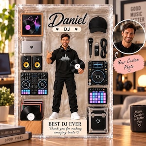 May include: A custom action figure set in a clear display case featuring a DJ named Daniel, a black cap, microphone, USB drive, cables, speakers, DJ controller, vinyl records, and a case. The base reads BEST DJ EVER Thank you for making amazing beats.