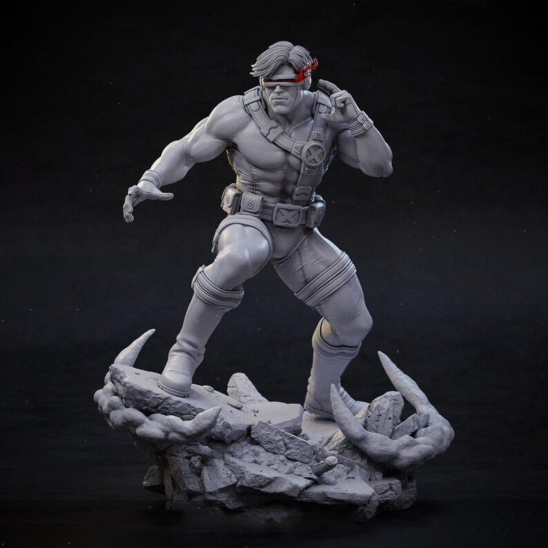 May include: A gray Cyclops statue, a superhero figure, stands on a rocky base. The figure is in a dynamic pose, wearing a costume with an "X" emblem and a red visor. The statue is detailed and muscular, with a serious expression.