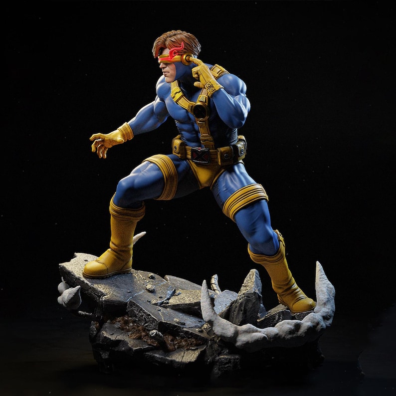 May include: A detailed figurine of Cyclops from the X-Men, in a dynamic pose. The figure is clad in a blue and yellow costume, with a red visor. The base is a detailed, rocky terrain. The overall aesthetic is comic book style.