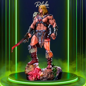 May include: A detailed statue of a muscular, blonde-haired warrior in a heroic pose, holding a sword. He wears a chest plate, fur-lined boots, and a loincloth. The statue is on a rocky base with a defeated foe. The word "Rilabe" is in the top corner.