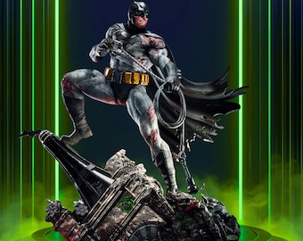 May include: A detailed statue of Batman in a dynamic pose, standing on a destructed structure. The figure is predominantly gray with black accents, a yellow utility belt, and a black cape. The statue has a realistic design with visible battle damage and is set against a neon green backdrop.