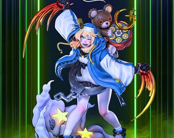 May include: A detailed figurine of a character from the game Guilty Gear. The character is wearing a blue and white outfit with a hood, and is holding a weapon. A teddy bear is attached to the character's back. The figurine is on a base with star-shaped accents. The word "Rilabe" is written on the top.